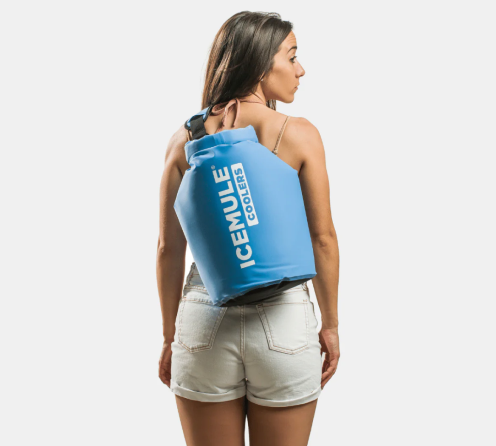 A girl wearing an IceMule Cooler Bag which is comparable to the Yeti soft coolers