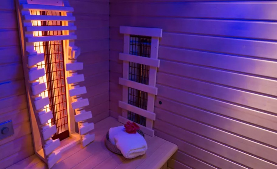 infrared sauna with stack of towels