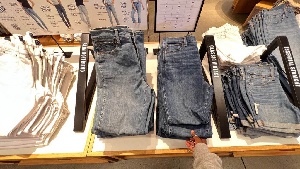 Hand grabbing a pair of jeans