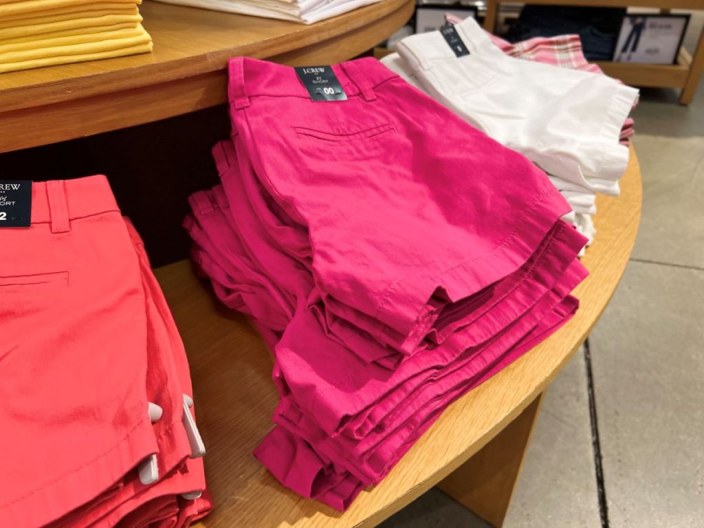Stacks of women's shorts folded on a table