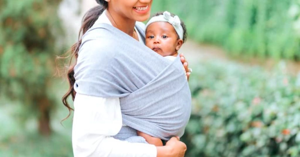 a mom with a baby in a KeaBabies Baby Wrap Carrier 