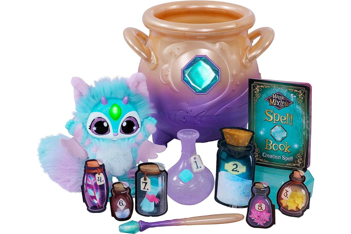 Magic Mixies Magical Misting Cauldron with Interactive Blue Plush Toy stock image