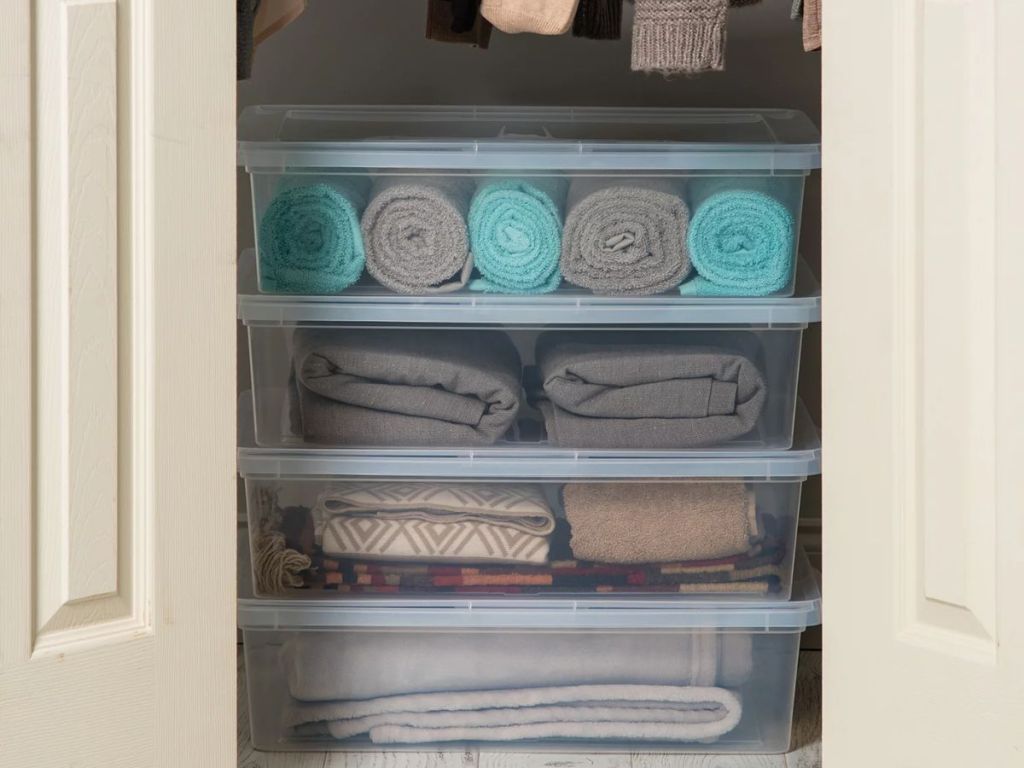 Clear storage containers in a closet