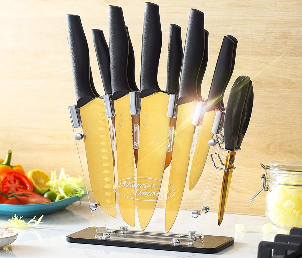 black and gold kitchen knife set in a clear knife holder