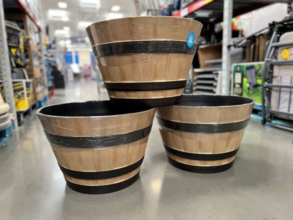 Three wine barrel planters stacked on each other