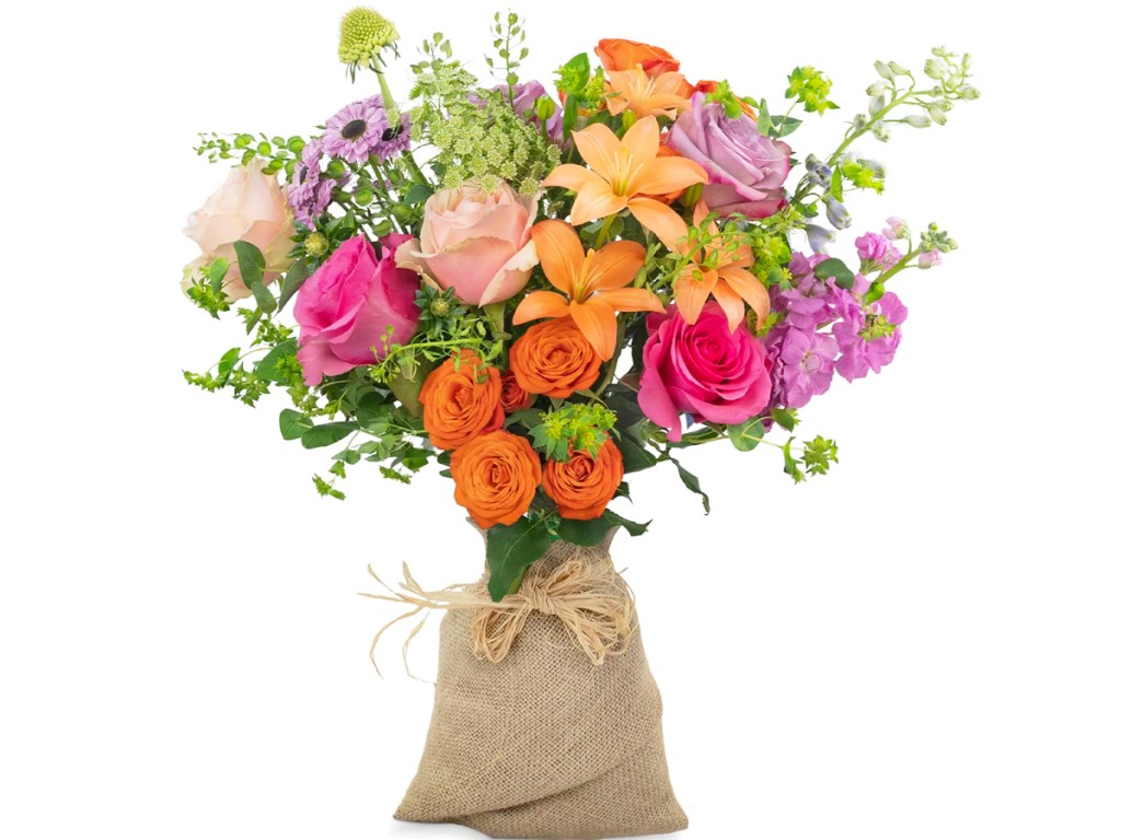 orange, pink, and purple flowers in a burlap wrap