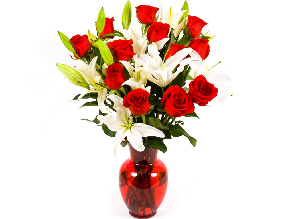 red roses and white lilies in red vase