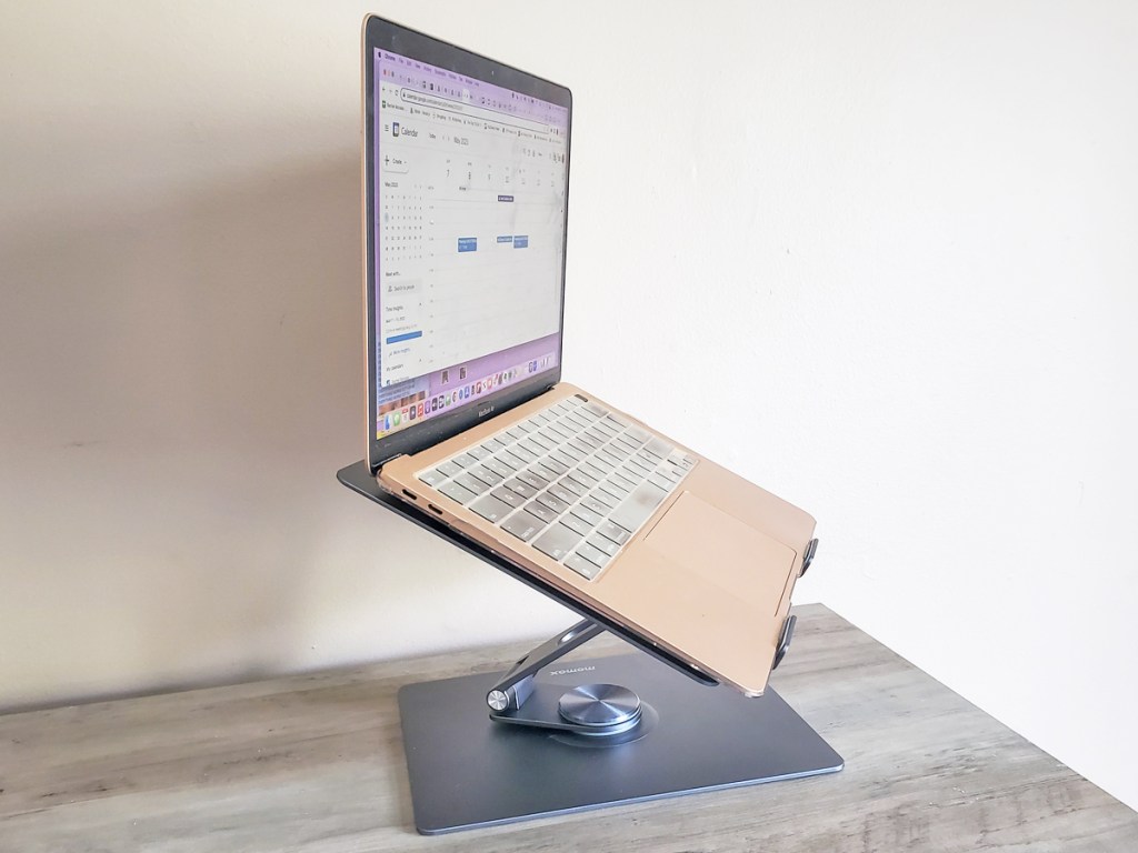 macbook on a grey laptop stand