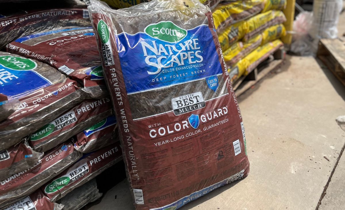 A bag of brown Mulch in the garden department at Lowes