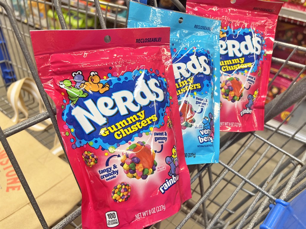 three bags of nerds gummy clusters in shopping cart