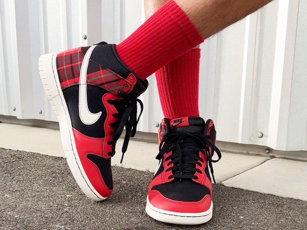 wearing pair of black and red plaid nike dunks