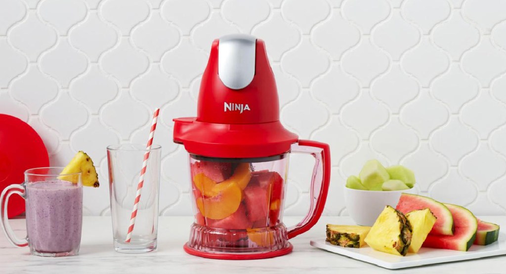 Ninja Storm 40 oz. Food and Drink Maker filled with fruits to make a smoothie