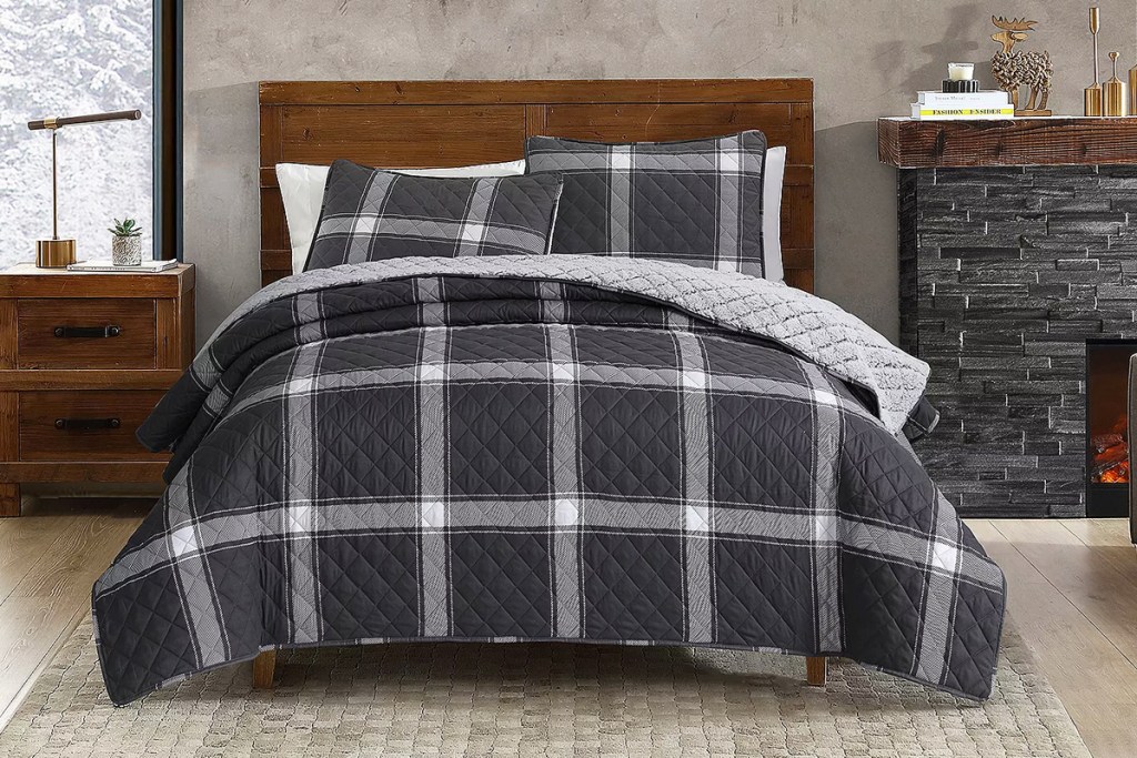 black and white plaid quilt set on bed