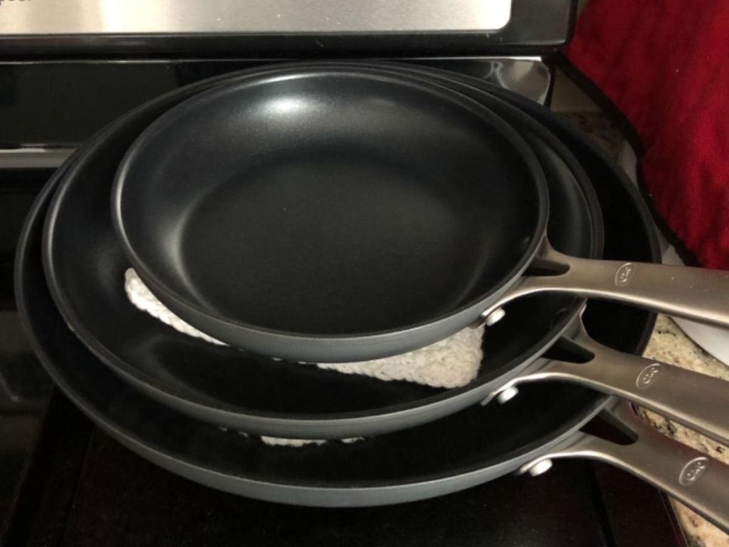 a stack of 3 OXO Good Grips Frying pans 