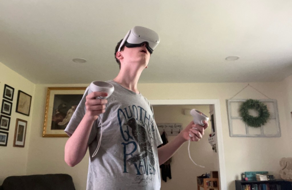 Boy playing a game on the Oculus Quest 2