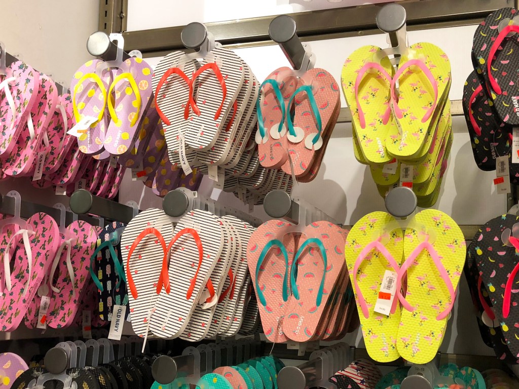 printed flip flops on display in store