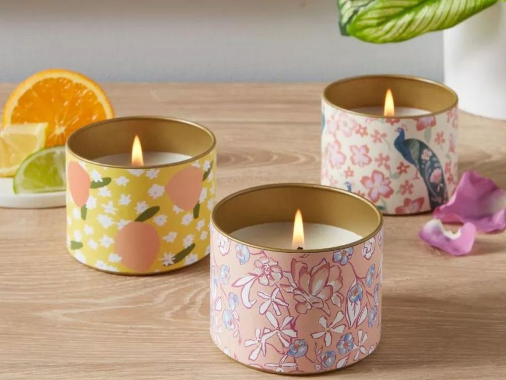 3 Opalhouse mini candle tins on a table