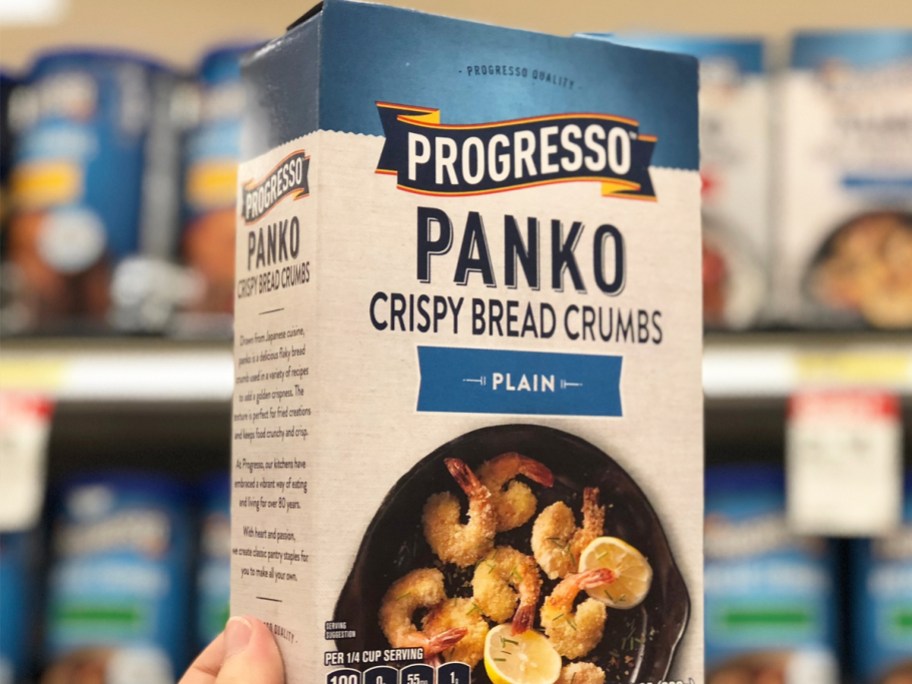 hand holding up a box of Progresso Panko Crispy Bread Crumbs in store