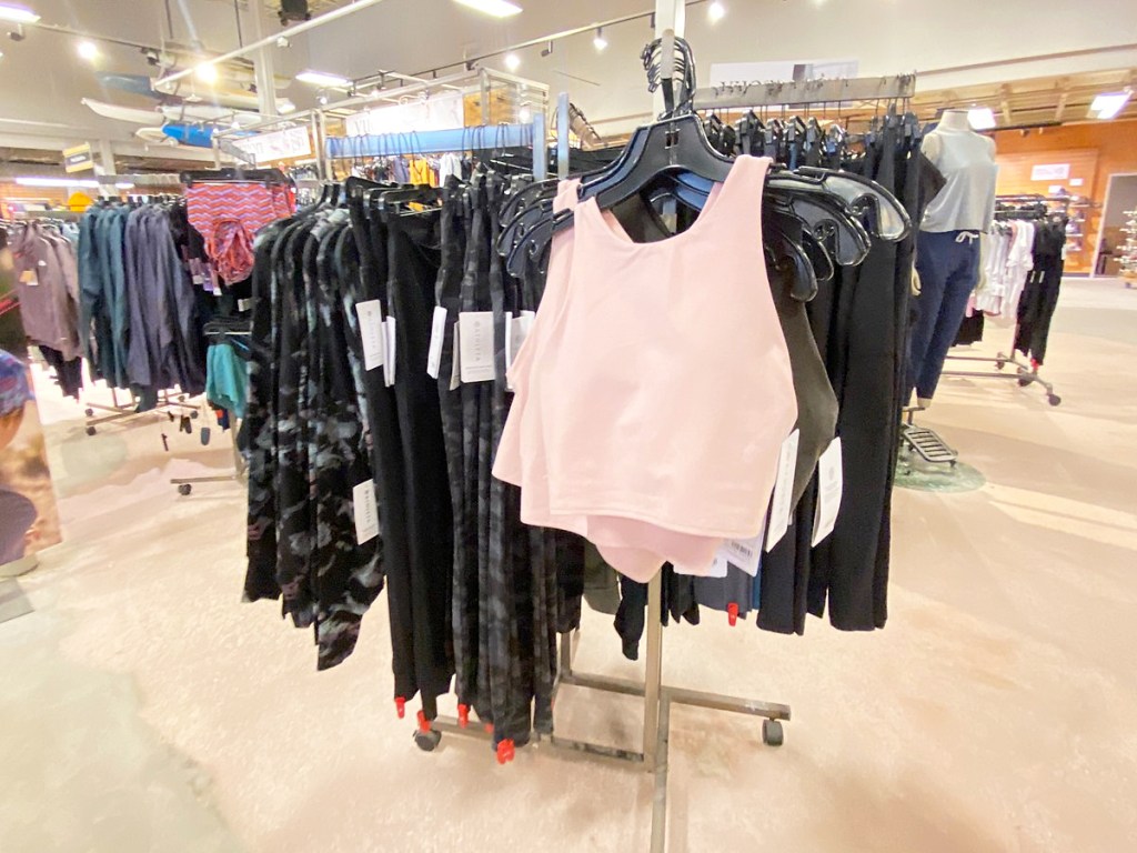 sports bra and leggings display inside REI store
