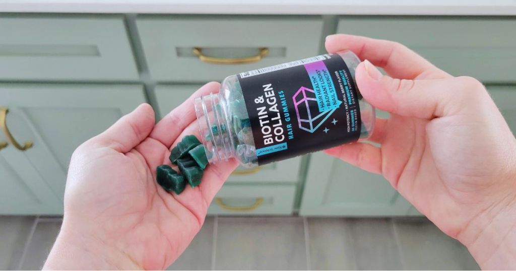 person pouring bottle of Raw Science Beuaty Complex Biotin & Collagen hair gummies into hand