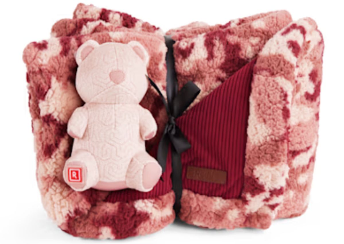 a Burgundy Blanket & pink teddy bear bundles together with a black ribbon