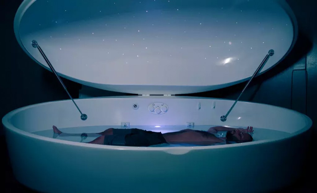 person floating in relaxation tank