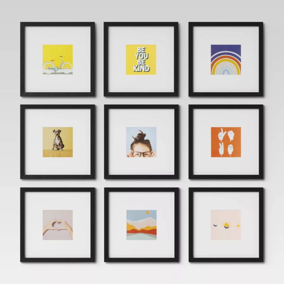 9 black picture frames hanging on a wall in a 3 x 3 layout