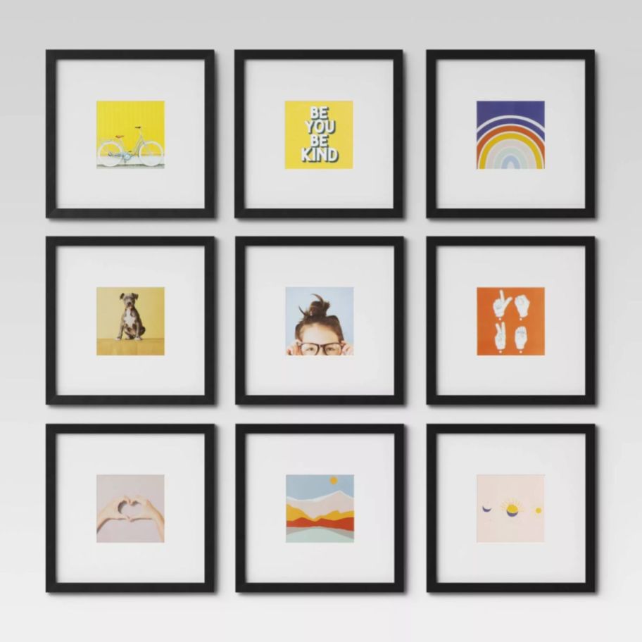 9 black picture frames hanging on a wall in a 3 x 3 layout
