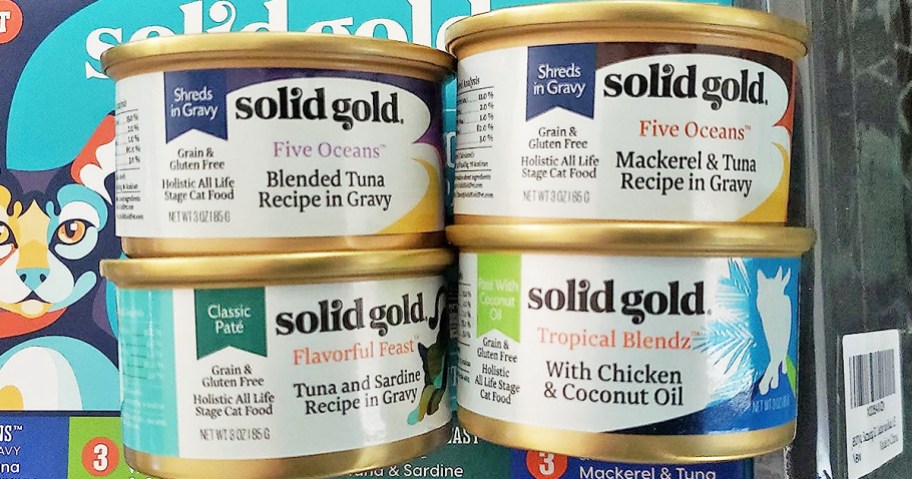 4 cans of solid gold wet can food in various flavors