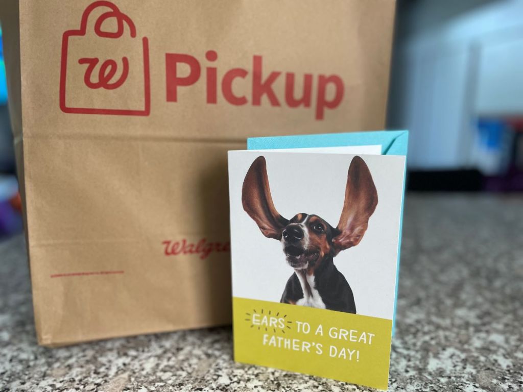 Father's Day card next to a Walgreens bag