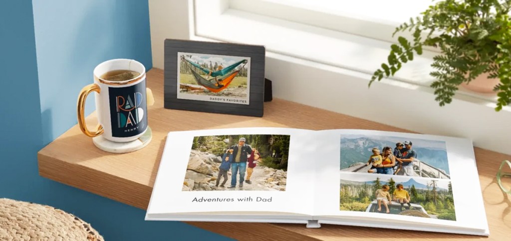 father's day photo book, dad mug, and framed photo in background
