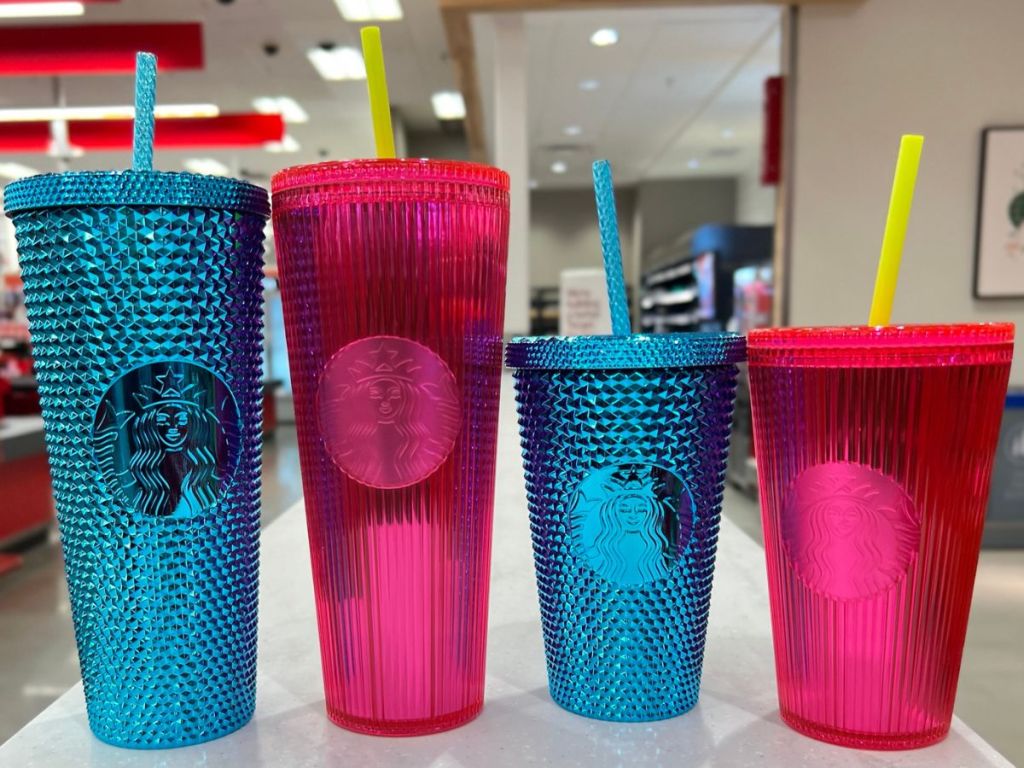 4 new Strabucks Bling Cold Cups lined up on a ledge