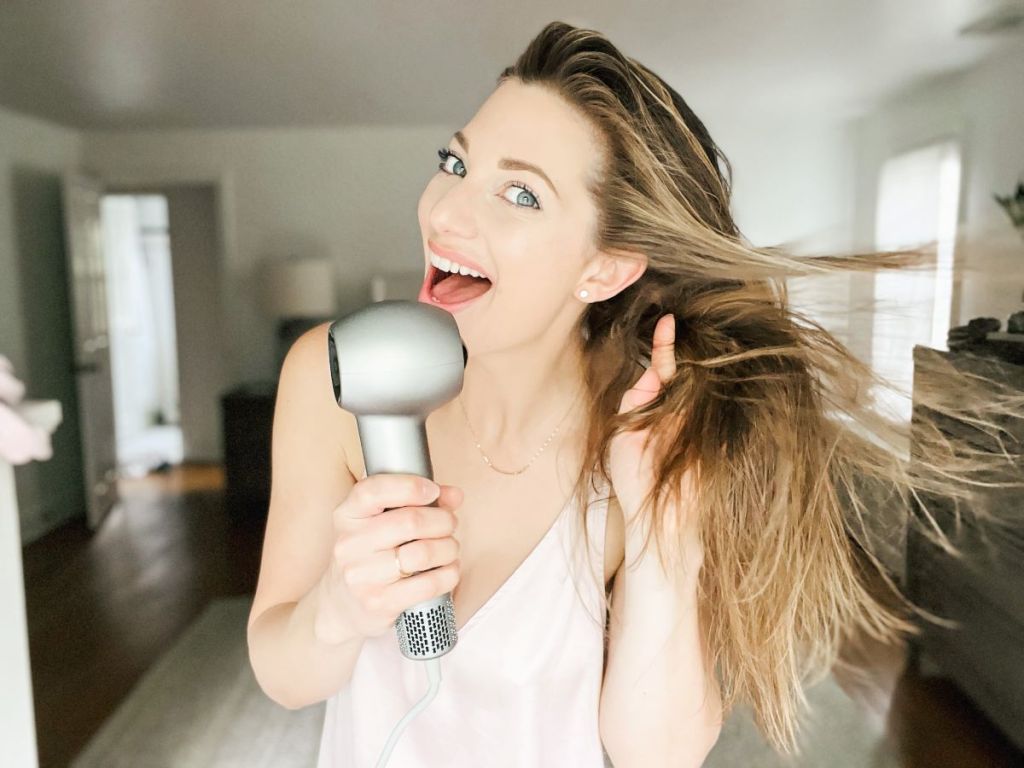 Woman blow drying her hair