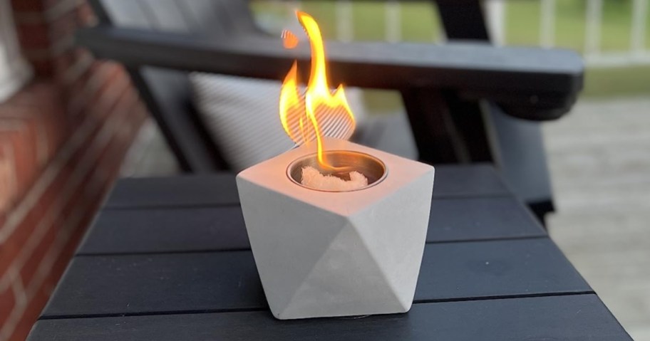 concrete tabletop fire pit in light gray on patio table