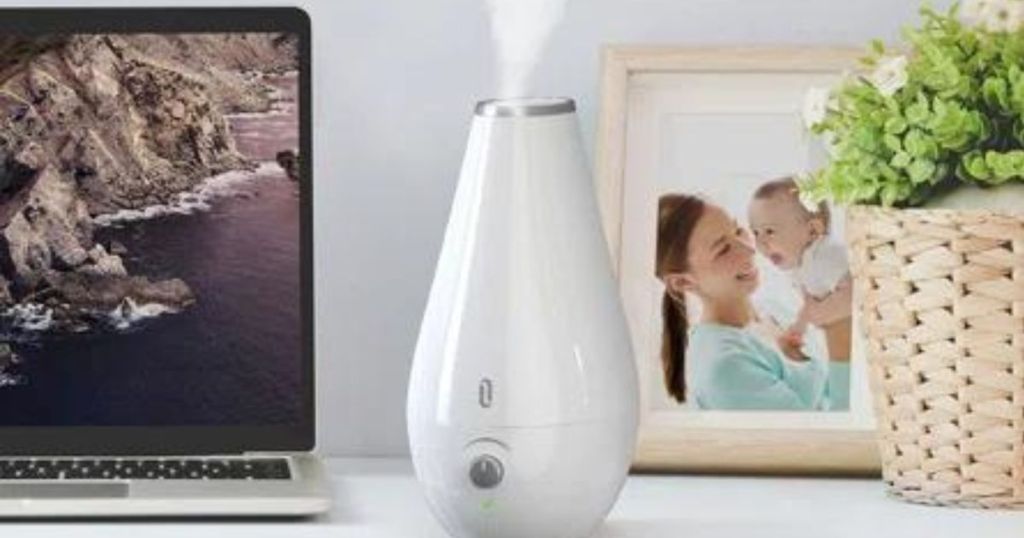 Taotrinics 2.5L Cool Mist Humidifier on desk next to a framed picture and a laptop