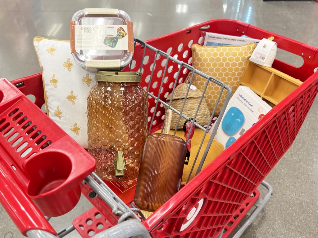 various summer items inside a red target shopping cart