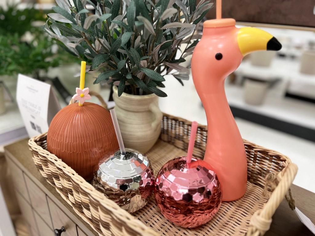 coconut, flamingo, and disco ball tumblers in basket