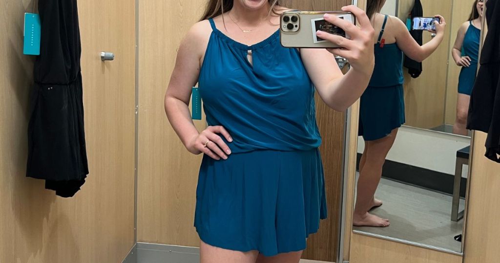 Woman in dressing room wearing a Target swim romper