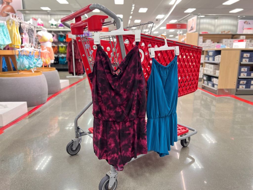 Swim rompers hanging on a Target cart