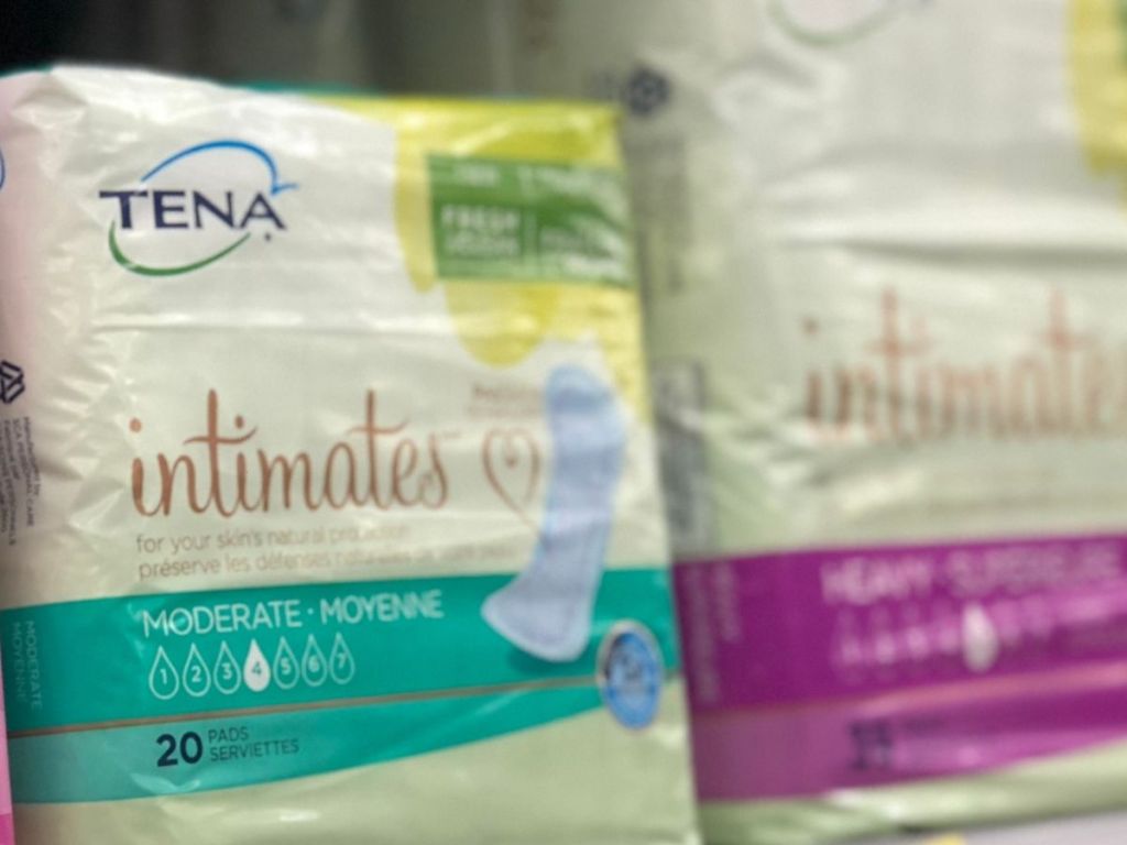 Packs of Tena Intimates pads on store shelf