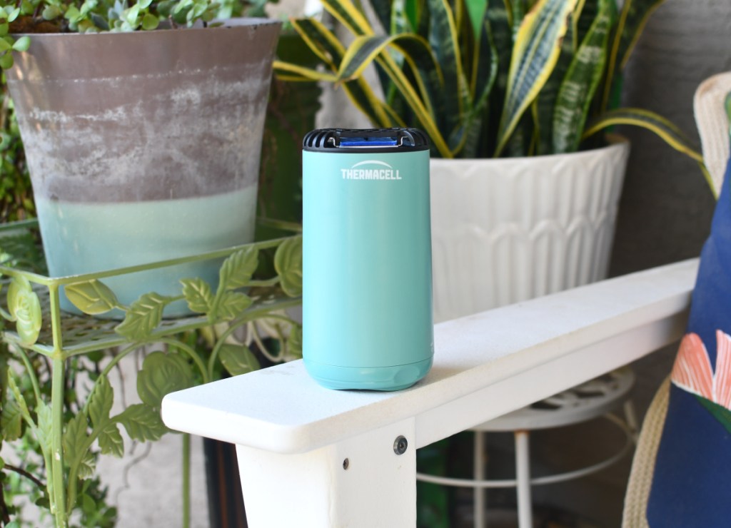 Thermacell Mosquito Repellent sitting on an outdoor patio chair