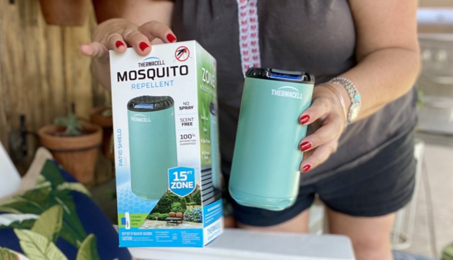 woman holding Thermacell Mosquito Repellent