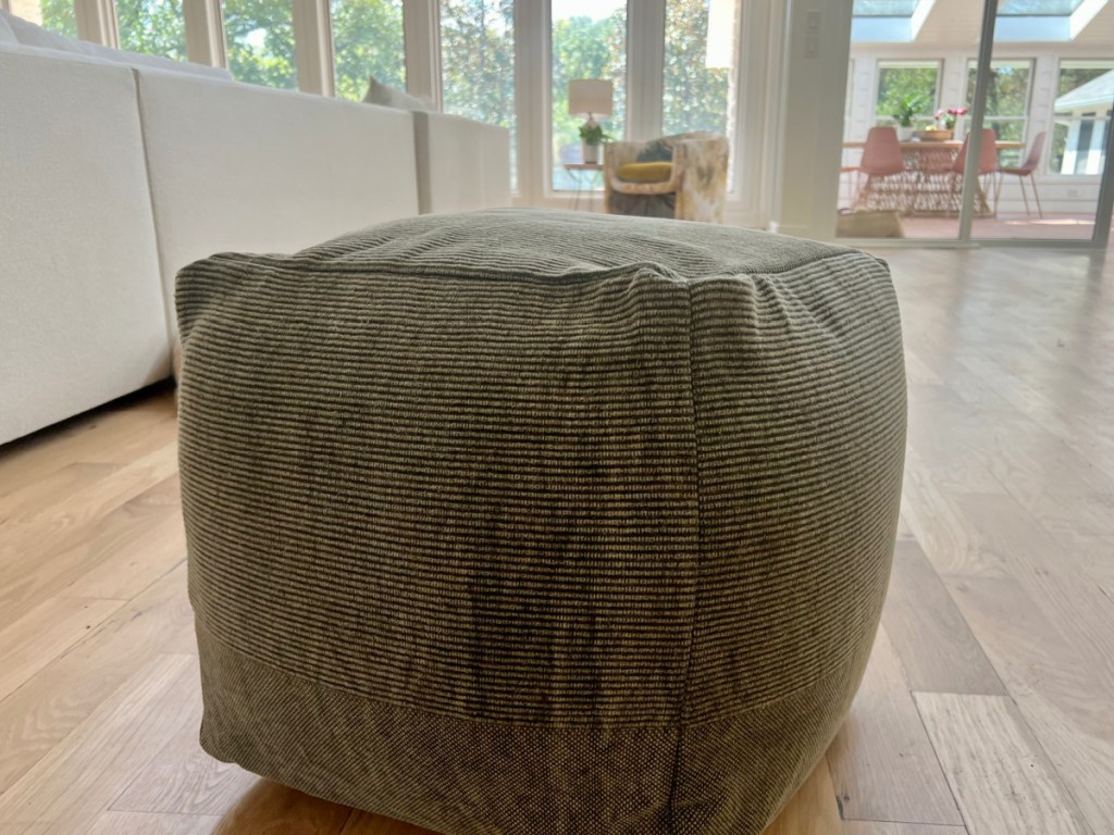 Threshold Hazel Stone Washed Canvas Pouf with Removable Fill Olive Green in living room