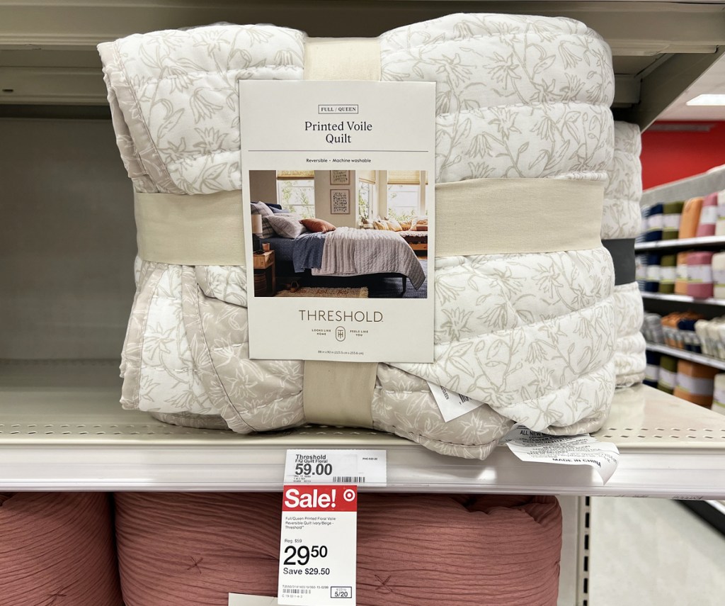 white printed quilt on store shelf