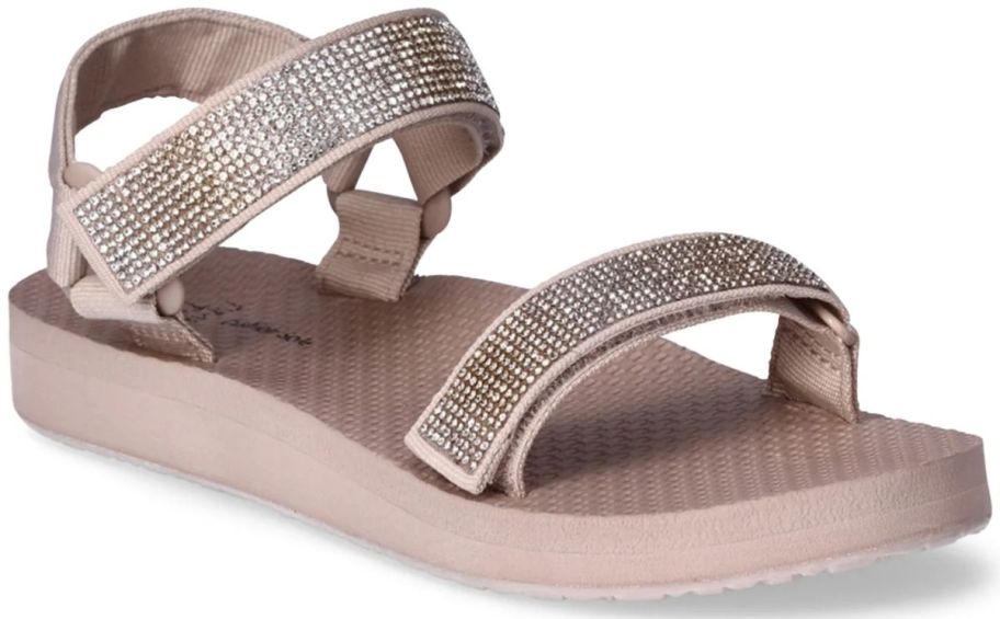 a khaki colored footbed sandal with blinged out straps