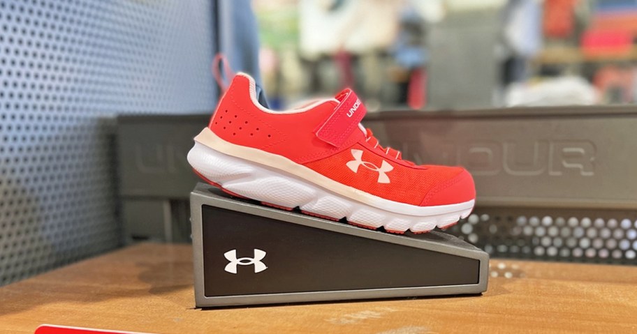 red under armour running shoe on display in store