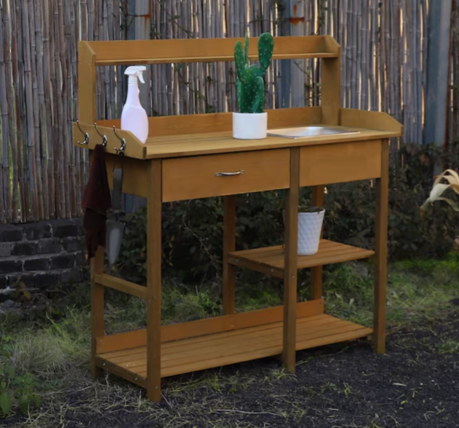 a wooden potting bench table from Lowe's SpringFEST 2024