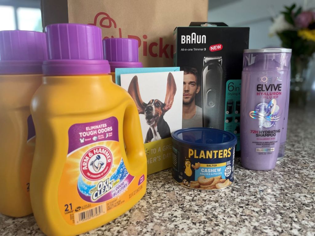 Arm & Hammer laundry detergent, L'Oreal haircare, Braun trimmer, Planters cashews and a card