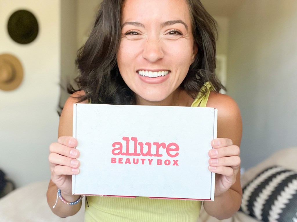 Woman Excitedly Holding Allure Beauty Box