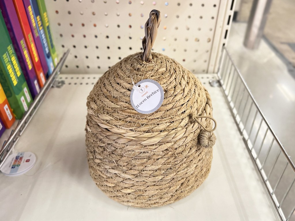 beehive shaped basket on white shelf